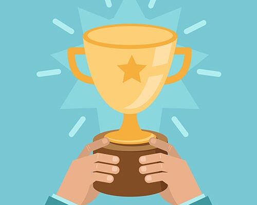 A simple illustration of a pair of hands holding up a trophy. The gold trophy has a star on it. Rays and a starburst radiate out from the trophy.