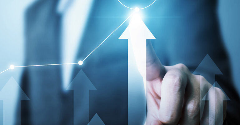 A graph showing a man pointing at 2021 and an up arrow showing growth in 2021
